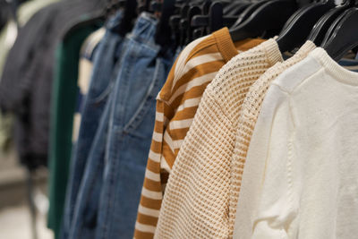 Close-up of clothes hanging in store