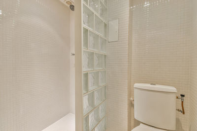 Interior of white colored bathroom
