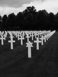 Row of cemetery against sky