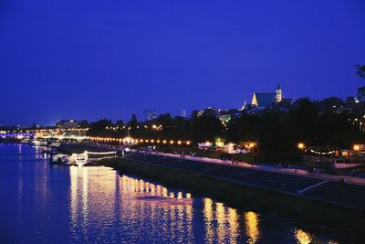 View of illuminated cityscape against clear sky