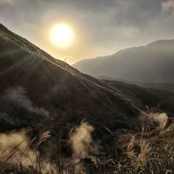 Scenic view of mountains against sky during sunset