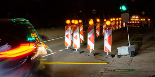 Car with light reflection of a traffic light are driving