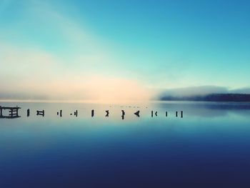 Scenic view of lake ukiel against sky during sunrise