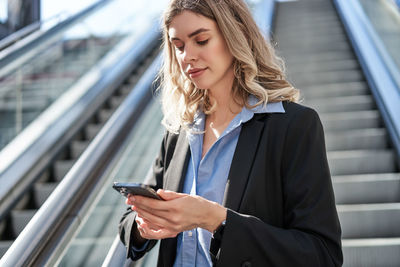 Young woman using mobile phone