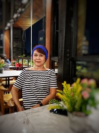 Portrait of woman sitting at restaurant