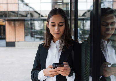 Young woman using mobile phone