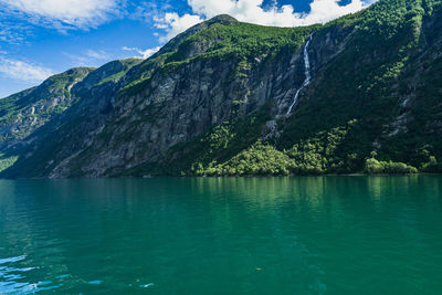 Geirangerfjord has impressive natural landscape with waterfalls overlooking the fjord, norway
