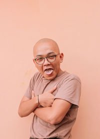 Portrait of man wearing mask against white background