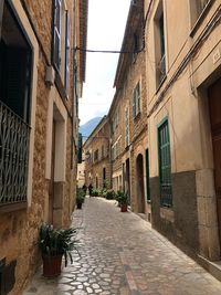 Narrow alley amidst buildings in town