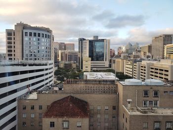 High angle view of buildings in city against sky