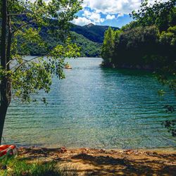 Scenic view of lake with mountains in background