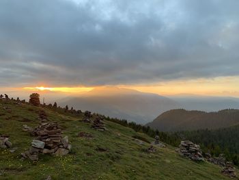 Scenic view of field against sky during sunset