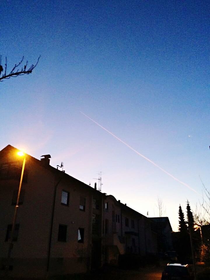 built structure, architecture, building exterior, house, sky, residential building, no people, city, sunset, row house, antenna - aerial, vapor trail, outdoors