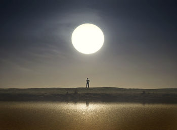 Scenic view of silhouette landscape against clear sky at sunset