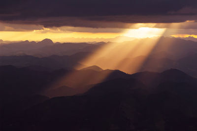 Scenic view of mountains against sky during sunset