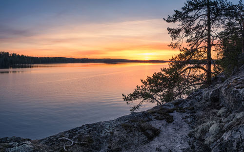 Scenic view of lake against sky during sunset