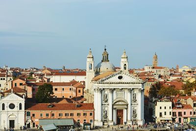 Buildings in city against sky