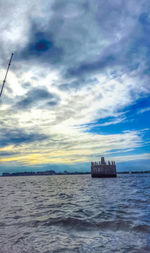 Scenic view of sea against cloudy sky