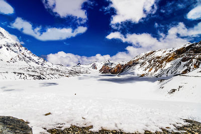 Scenic view of snowcapped mountains against sky