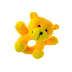 Close-up of yellow stuffed toy over white background