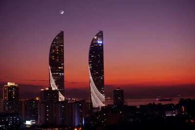 Illuminated buildings in city at night