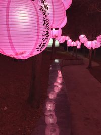 Text written on pink illuminated at night