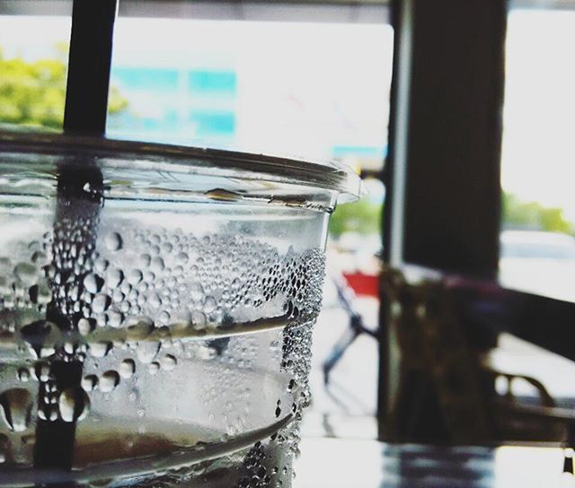 focus on foreground, close-up, food and drink, indoors, glass - material, transparent, refreshment, table, freshness, drink, still life, selective focus, drinking glass, window, metal, day, water, no people, glass, container