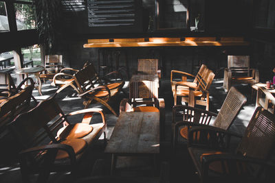 Empty chairs and tables in cafe