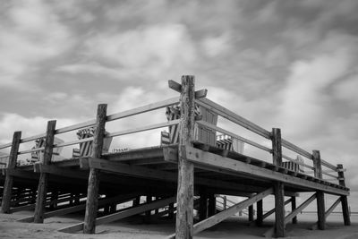 Low angle view of built structure against clouds