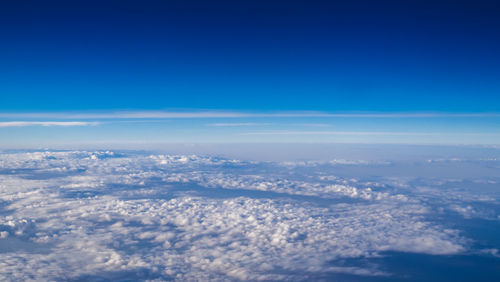 Beautiful clear blue sky over scattered of white clouds.