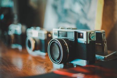 Close-up of camera on table