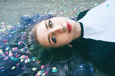 Portrait of young woman lying down