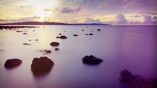 Scenic view of lake against sky during sunset