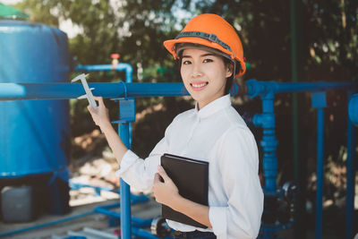 Portrait of smiling engineer working at industry