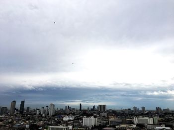 Buildings in city against sky