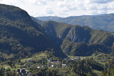 High angle view of townscape against mountains