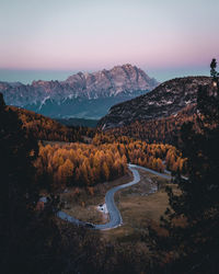 High angle view of road by mountains against sky