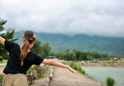 Back view point of young women walking and attempt to balance herself ,motivation recreation concept