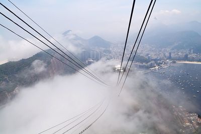 Clouds over power cables in city