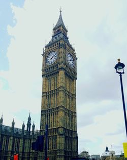 Low angle view of clock tower against sky