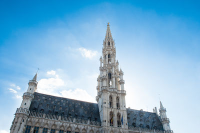 Low angle view of clock tower against sky