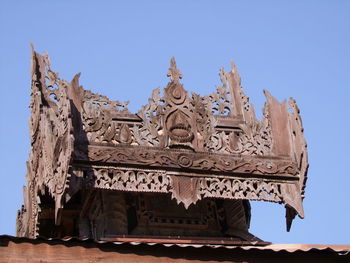 Low angle view of statue of temple against clear sky