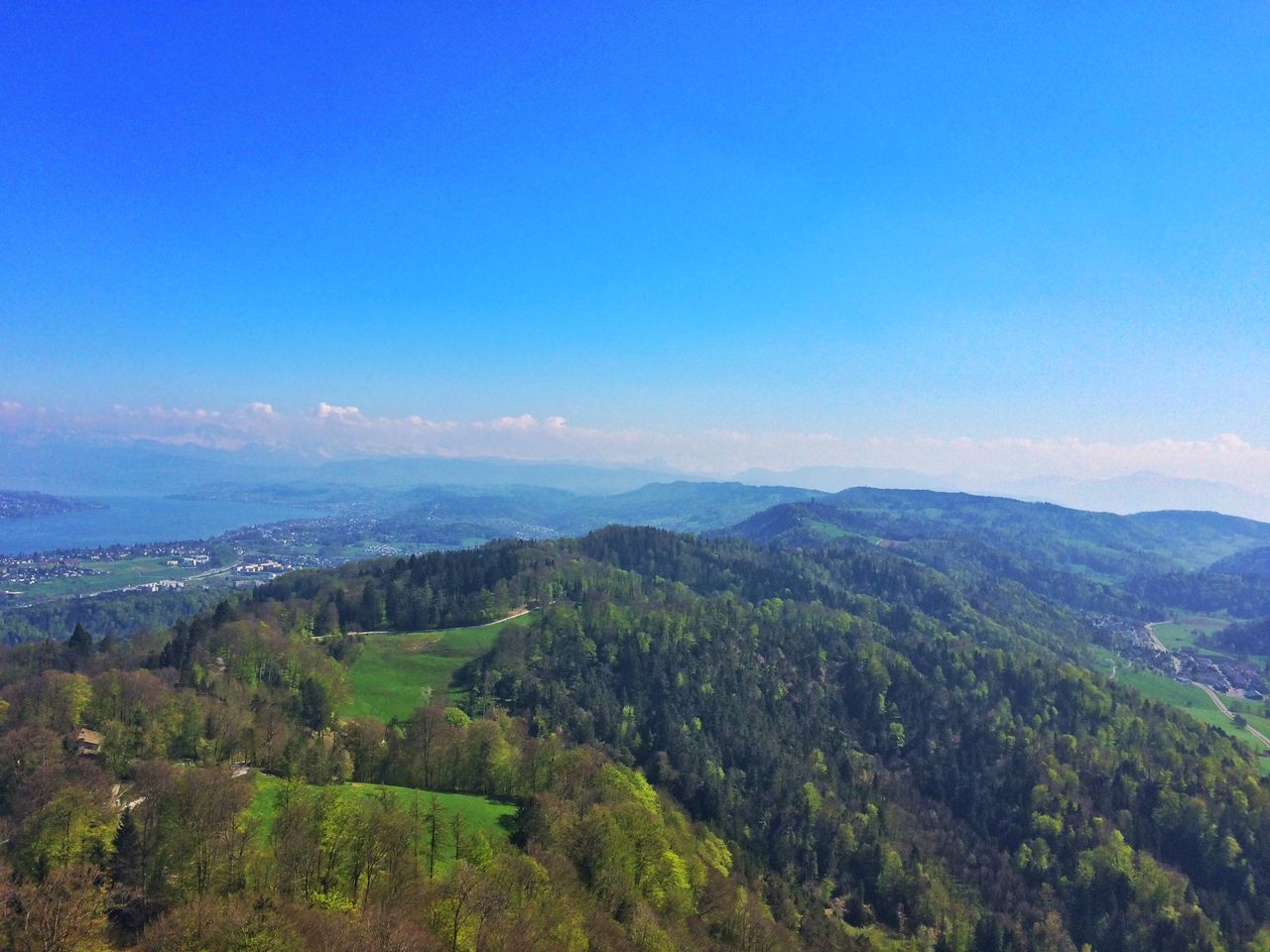 tranquil scene, mountain, scenics, landscape, tranquility, blue, beauty in nature, tree, nature, mountain range, copy space, sky, idyllic, clear sky, non-urban scene, high angle view, horizon over land, green color, remote, hill