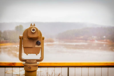 Close-up of coin-operated binoculars against sky in narrowsburg, ny