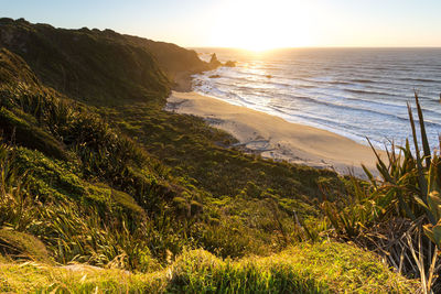 Scenic view of sea against sky during sunset