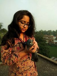 Indian holding pigeon at home kolkata india