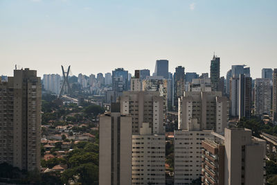 Modern buildings in city against sky