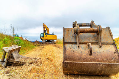 Close-up of excavator bucket at construction site. construction machinery.