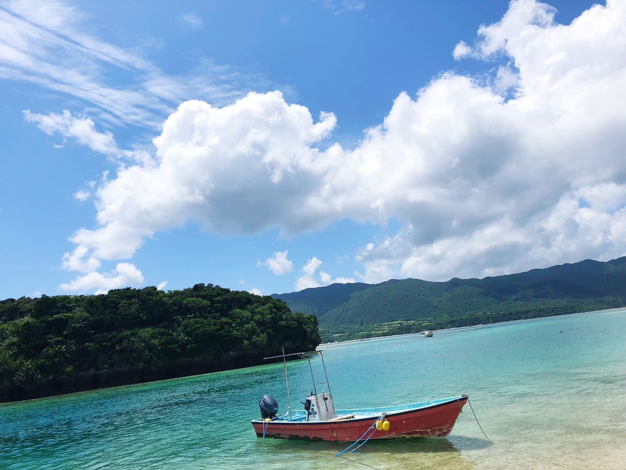 VIEW OF BOAT IN SEA AGAINST SKY