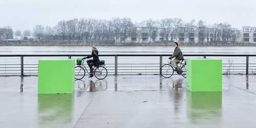 Rear view of man riding bicycle